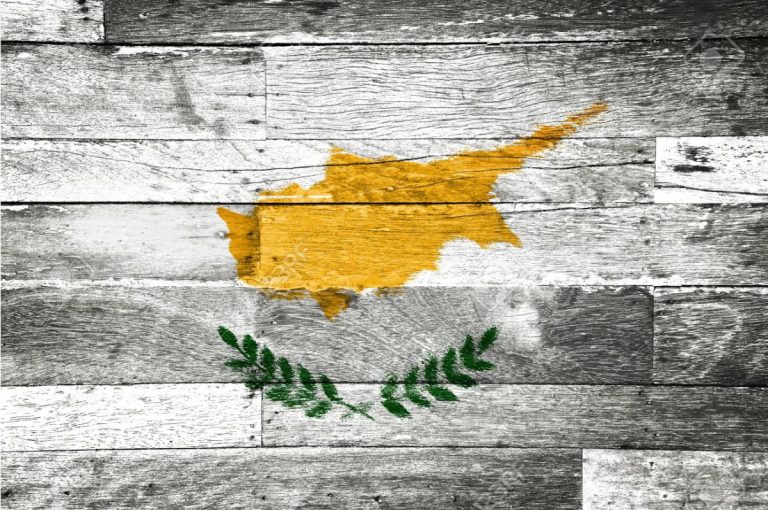 11698191-cyprus-flag-painted-on-old-wood-background-stock-photo